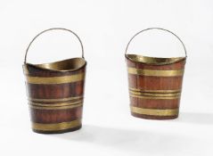 Two similar mahogany and brass bound kettle stands or buckets