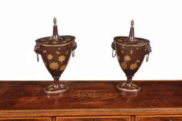 A pair of tôle peinte chestnut urns in Empire style