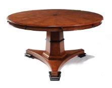 A burr walnut and ebonised extending dining table, in Regency style, by Arthur Brett