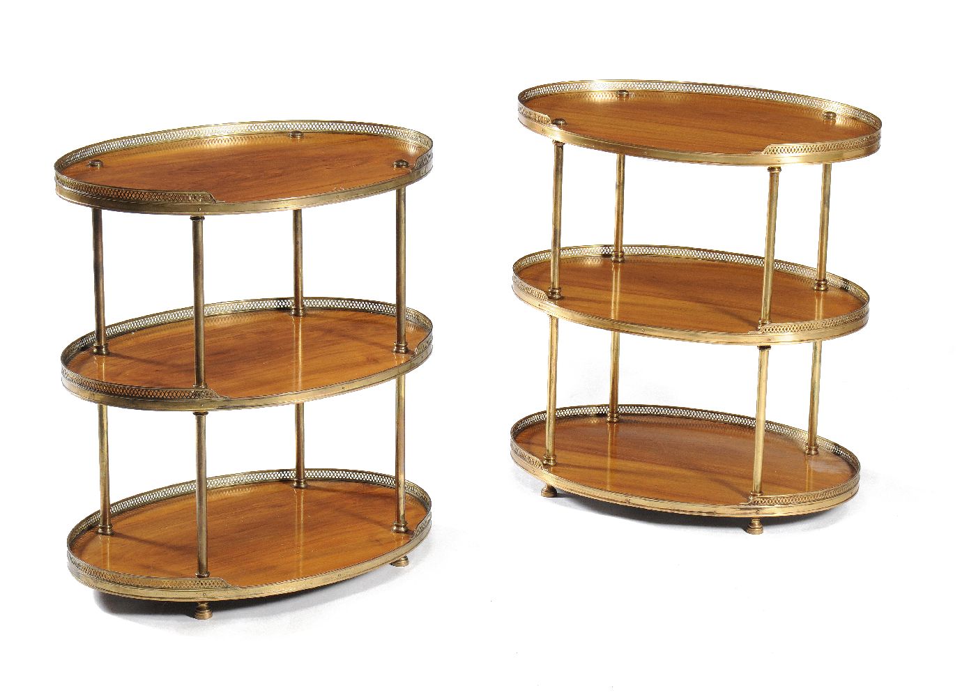A pair of figured walnut and gilt brass mounted three tier étagères