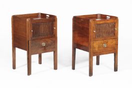 A pair of George III mahogany bedside cupboards