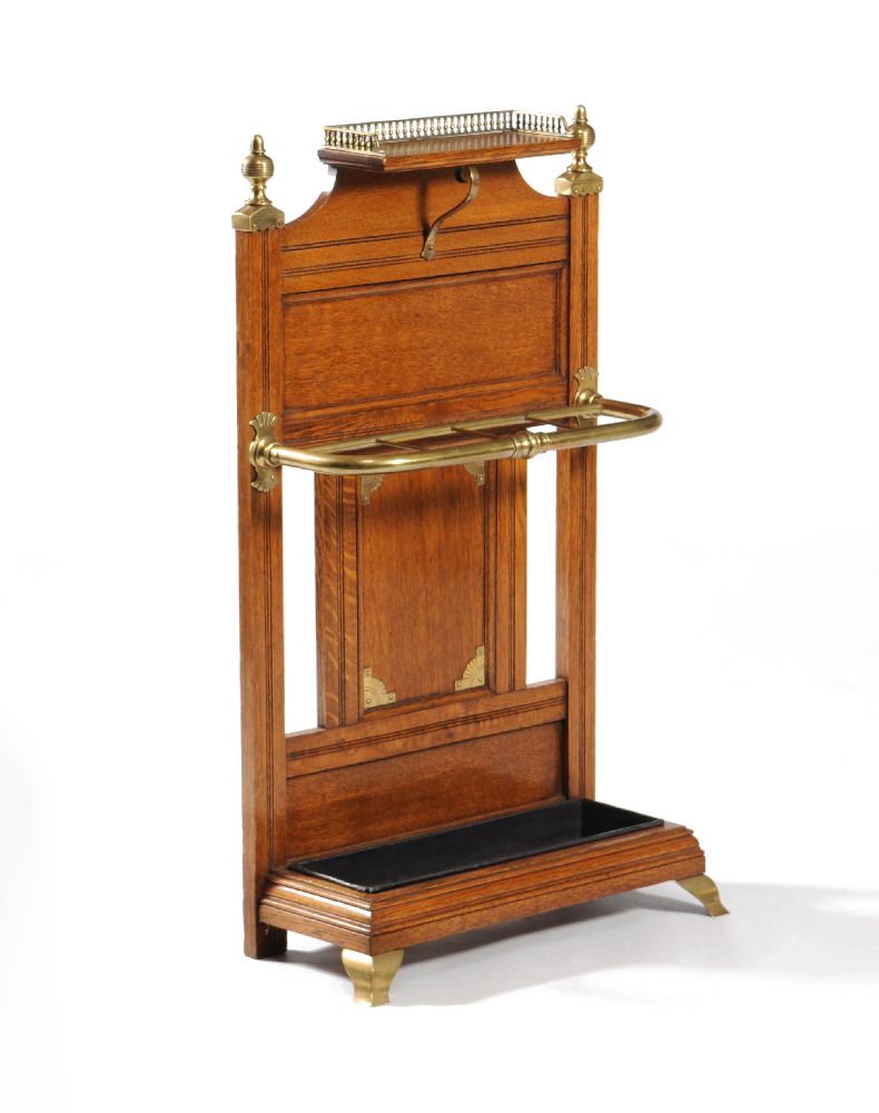 A Victorian oak and brass mounted hall stand by James Shoolbred & Company