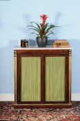ϒ A Regency rosewood and parcel gilt side cabinet