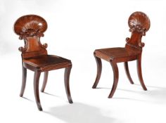 A pair of Regency mahogany 'shell back' hall chairs