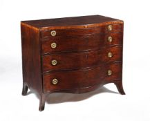 A George III mahogany and inlaid serpentine fronted chest of drawers