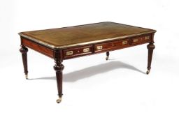A Victorian mahogany and gilt brass mounted library or writing table
