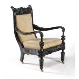 ϒ A Ceylonese solid macassar ebony armchair