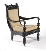 ϒ A Ceylonese solid macassar ebony armchair