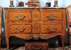 ϒ A kingwood, tulipwood and bois satine serpentine commode, in Louis XV/XVI transitional style