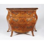 A pair of Continental figured walnut serpentine commodes