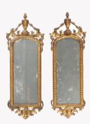 A pair of Continental carved giltwood wall mirrors
