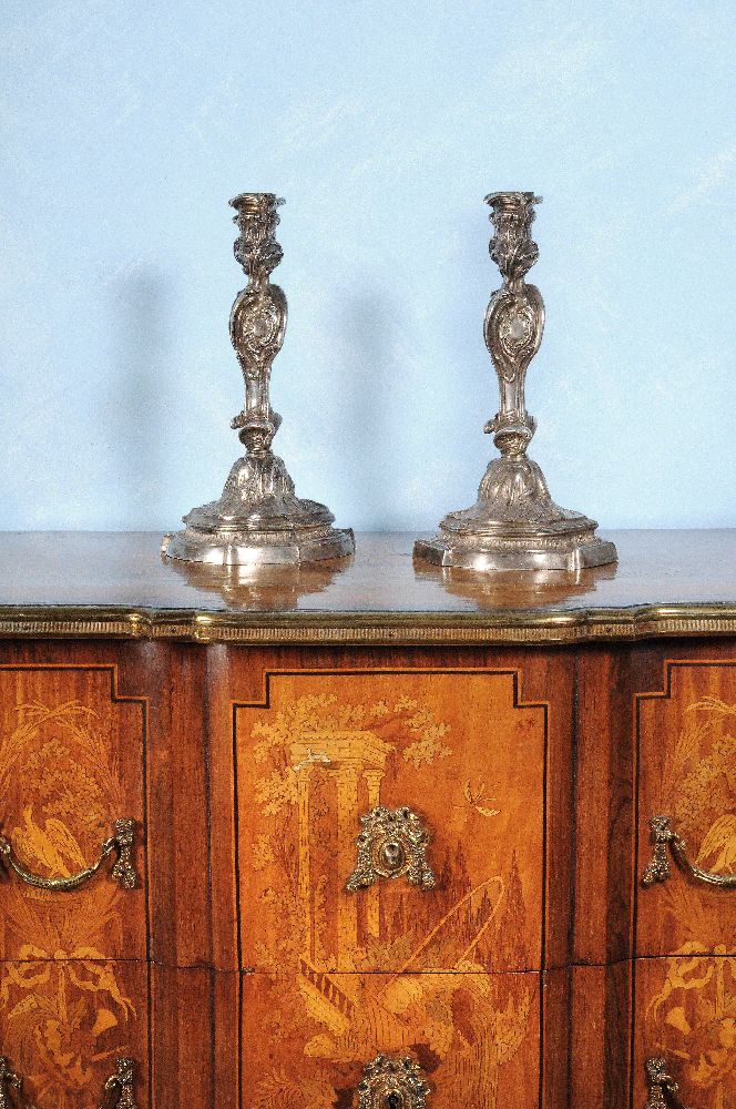 A pair of Louis XV silvered bronze candlesticks