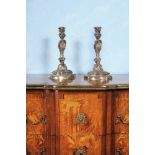 A pair of Louis XV silvered bronze candlesticks