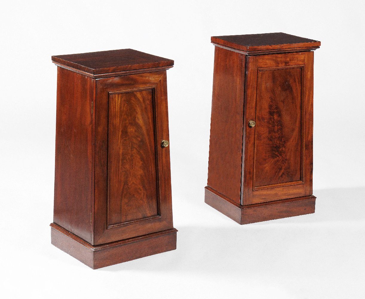 A pair of Victorian mahogany bedside cupboards