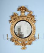 A George III giltwood and composition convex wall mirror