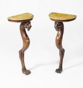 A pair of Regency pine and simulated marble console tables