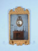 A George I giltwood and gesso girandole wall mirror