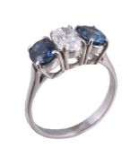 A diamond and sapphire three stone ring