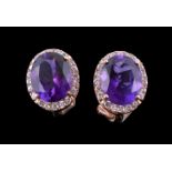 A pair of amethyst and diamond ear studs