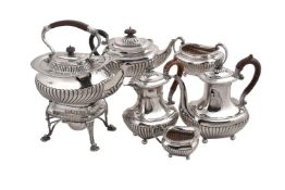 A matched Victorian silver six piece oblong baluster tea service