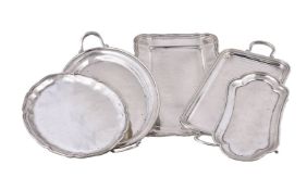 Five various Italian silver coloured trays, plates and a stand