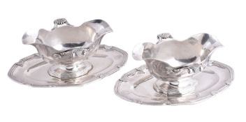 A pair of 19th century silver shaped oval sauce boats on stands