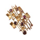 A 1970s gold coloured garnet brooch