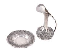 An Italian silver coloured ewer and basin