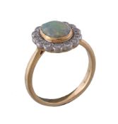 An 18 carat gold opal and diamond cluster ring