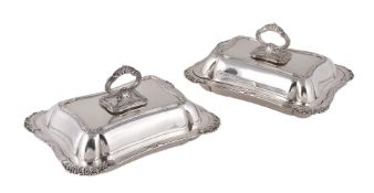 A pair of silver shaped rectangular entree dishes, covers and handles by Adolph Barsach Davis