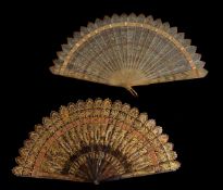 ϒ A horn and a tortoiseshell brisé fan