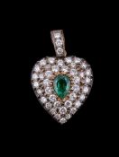 A diamond and emerald heart shaped pendant