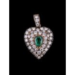 A diamond and emerald heart shaped pendant