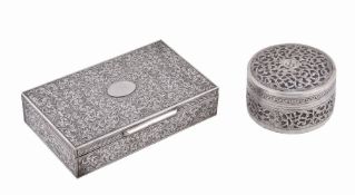 An Asian silver coloured cylindrical box and cover