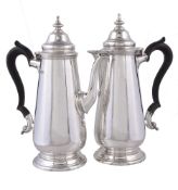 A pair of silver tapered café au lait pots by Thomas Bradbury & Sons Ltd