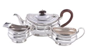 A silver oval three piece tea service by Adie Bros