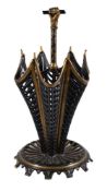 A late Victorian or Edwardian black and gold painted wrought and cast iron umbrella stand