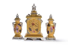 ‡ A French porcelain inset gilt and silvered brass mounted clock garniture in the Far Eastern taste