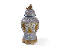 ‡ A Continental porcelain gilt-metal-mounted octagonal section chinoiserie baluster vase