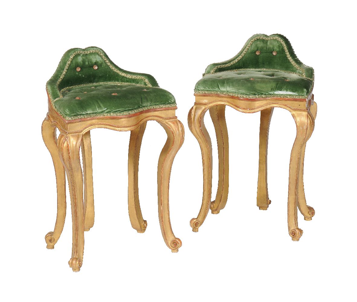 A pair of giltwood gondola or music stools