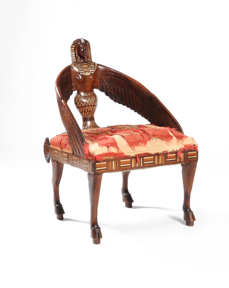 ‡ ϒ A carved hardwood and mother-of-pearl, bone and ivory inlaid ‘Egyptomania’ armchair