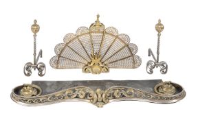 A steel and brass mounted fender in Rococo Revival style