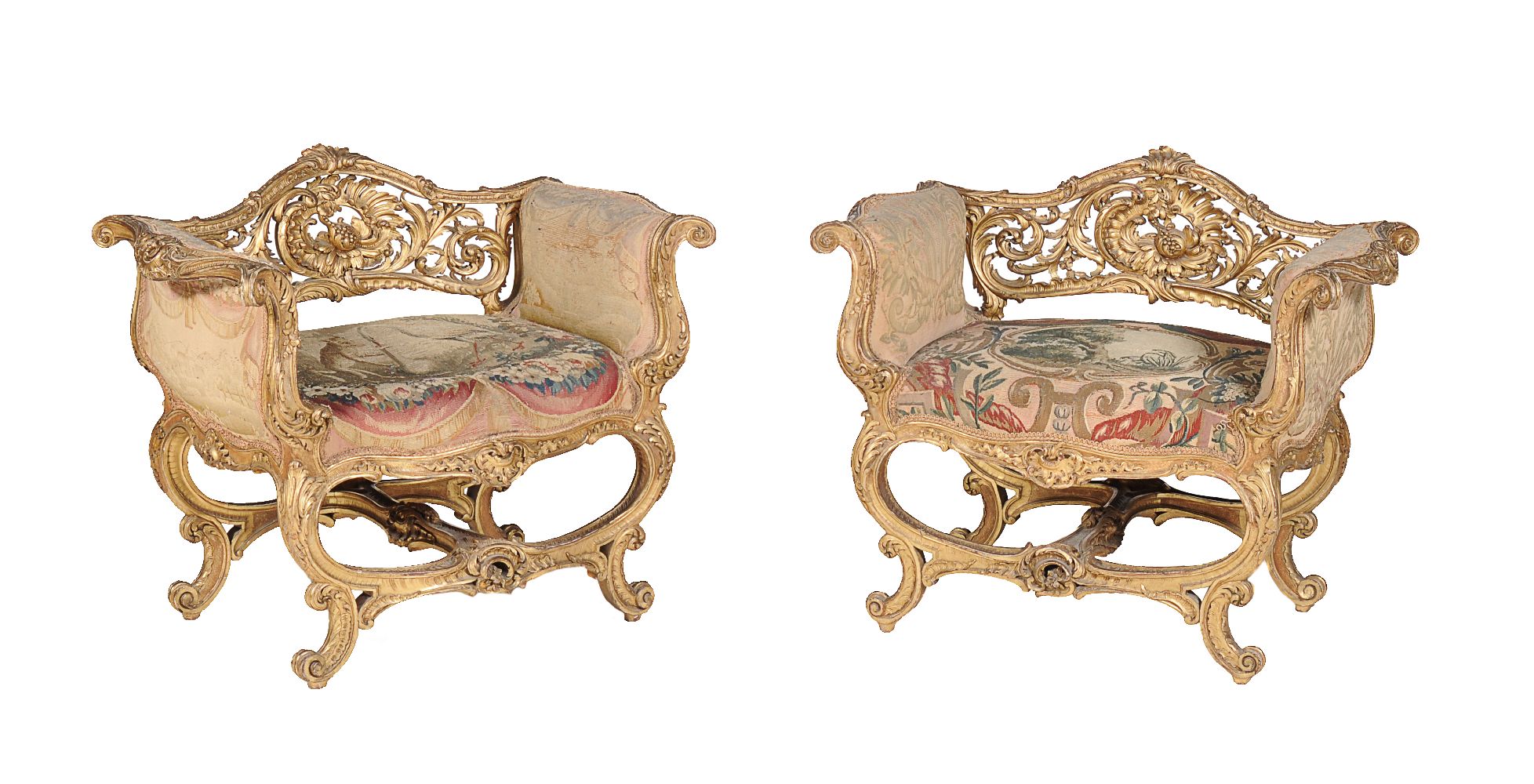 A pair of French carved giltwood and composition window seats