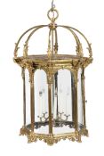 A substantial gilt metal and glazed five light octagonal hall lantern in Renaissance Revival taste