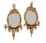 A pair of continental gilt composition twin girandoles