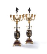 ‡ A pair of parcel gilt and black patinated bronze and marble candelabra