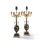 ‡ A pair of parcel gilt and black patinated bronze and marble candelabra