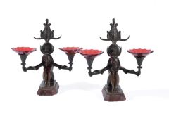 ‡ A pair of French patinated bronze & marble mounted twin light candelabra in Egyptian Revival taste