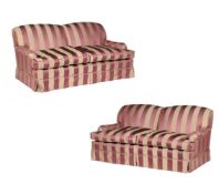 A pair of two seat sofas in striped upholstery