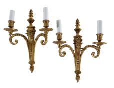 A pair of gilt bronze twin light wall appliques in Louis XVI taste